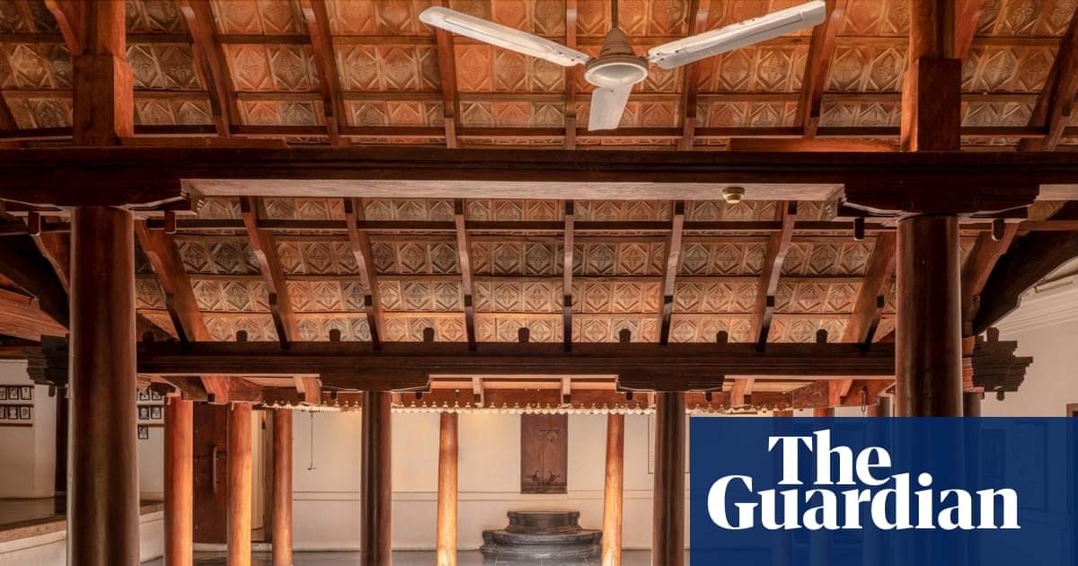 Restored tharavad courtyard in Kerala showing traditional wooden architecture