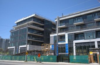 PCL Construction tops off Lakeview DXE Club condo development