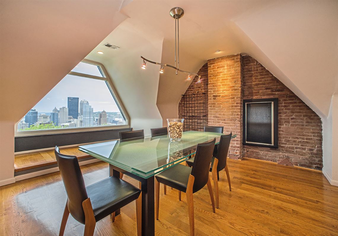 Dormer windows and vaulted ceiling detail in a Mount Washington condo dining room