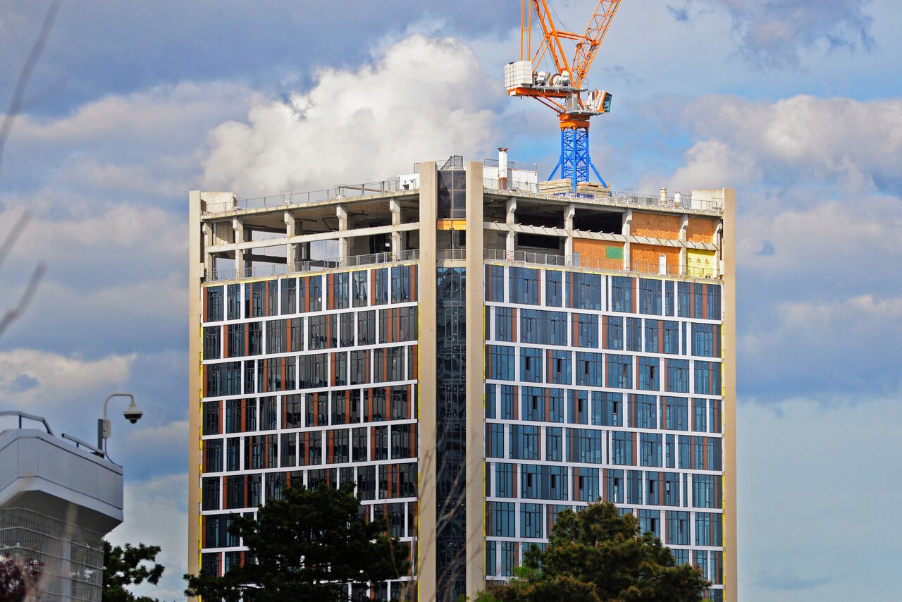 Facade installation progress at e lofts, the office-to-rental conversion at 250 Ferrand Drive in Toronto