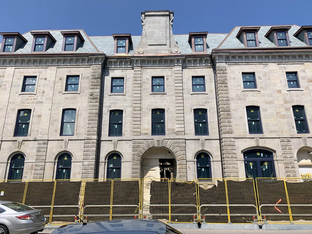 Restored limestone facade and window detailing on the Coppley Building in Hamilton