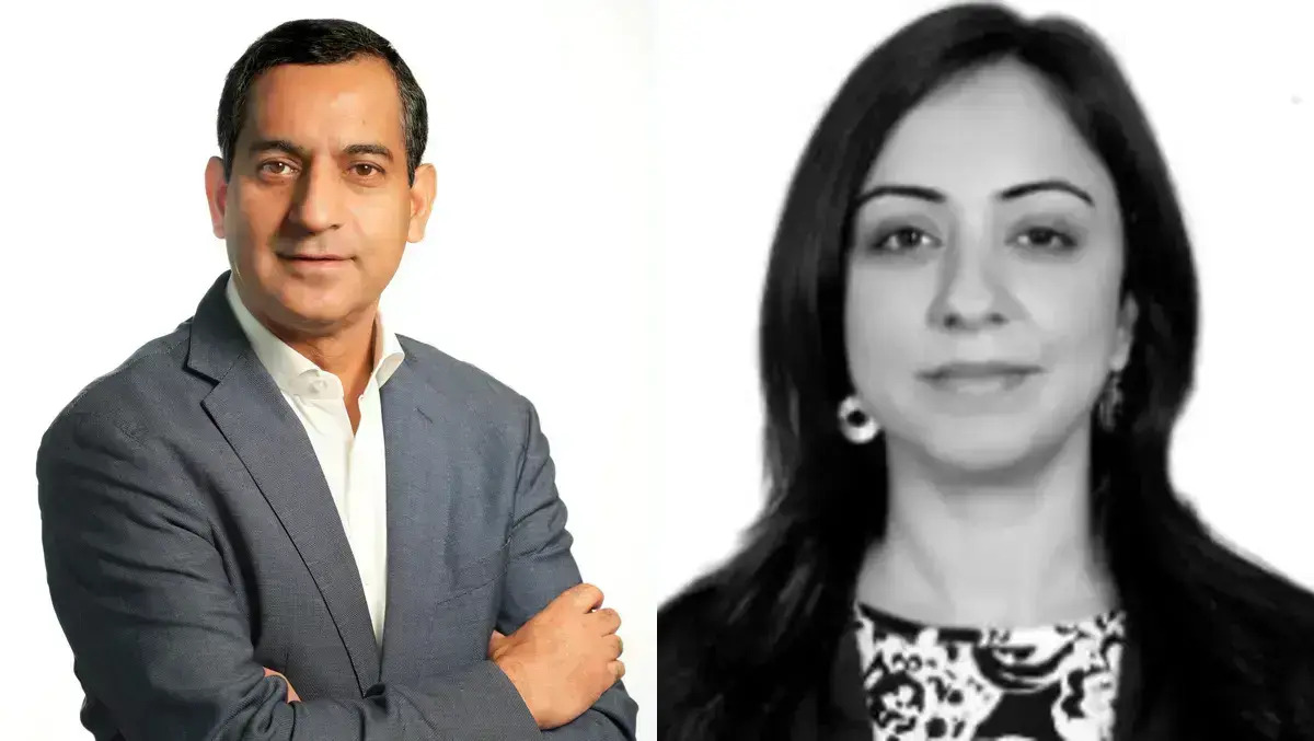 Corporate real estate professionals reviewing AI-driven data dashboards