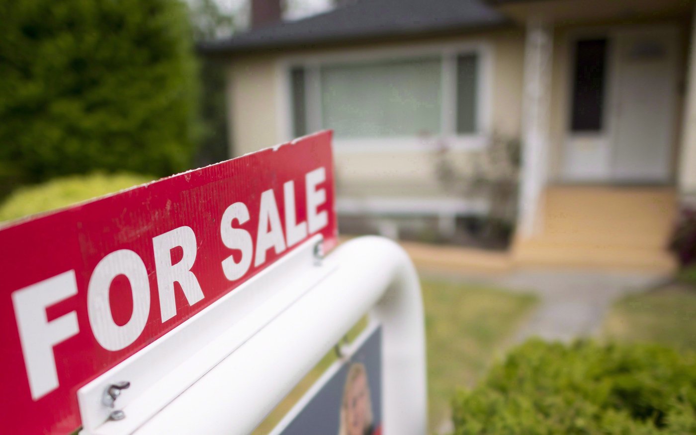 A residential street of homes for sale in a cooling housing market