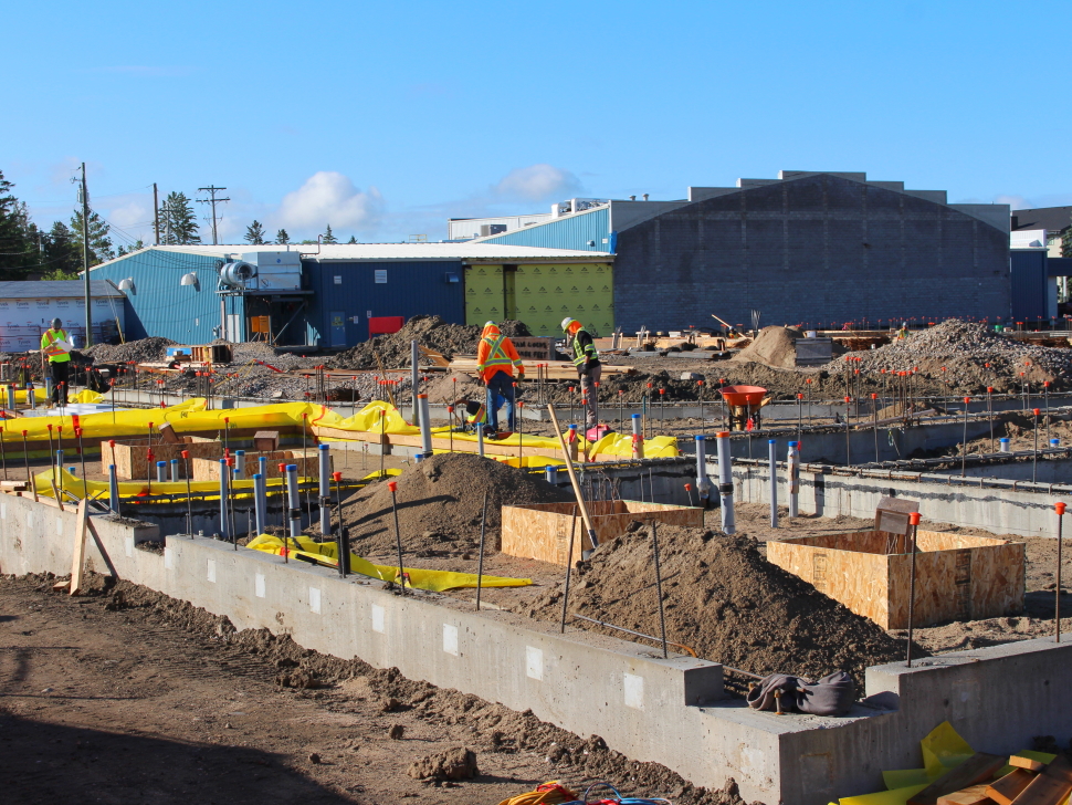 Residential construction site with framing underway