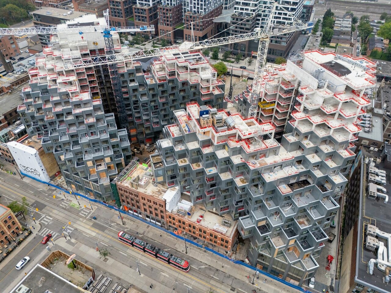Drone view of KING Toronto's cascading peaks and valleys under construction