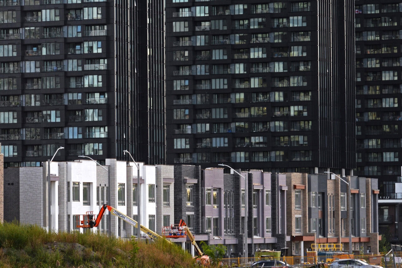A progression of shades from lighter to darker clad townhomes at the Crosstown Community, Toronto