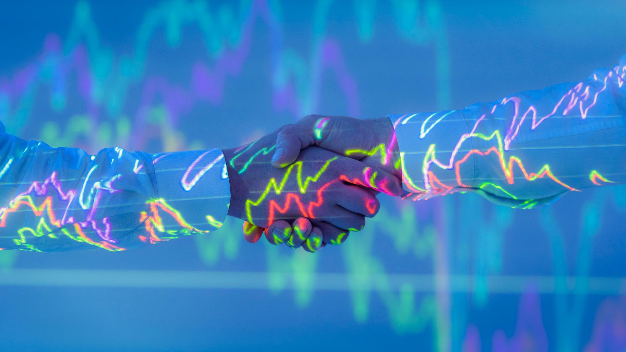 Real estate professional reviewing data alongside a client conversation